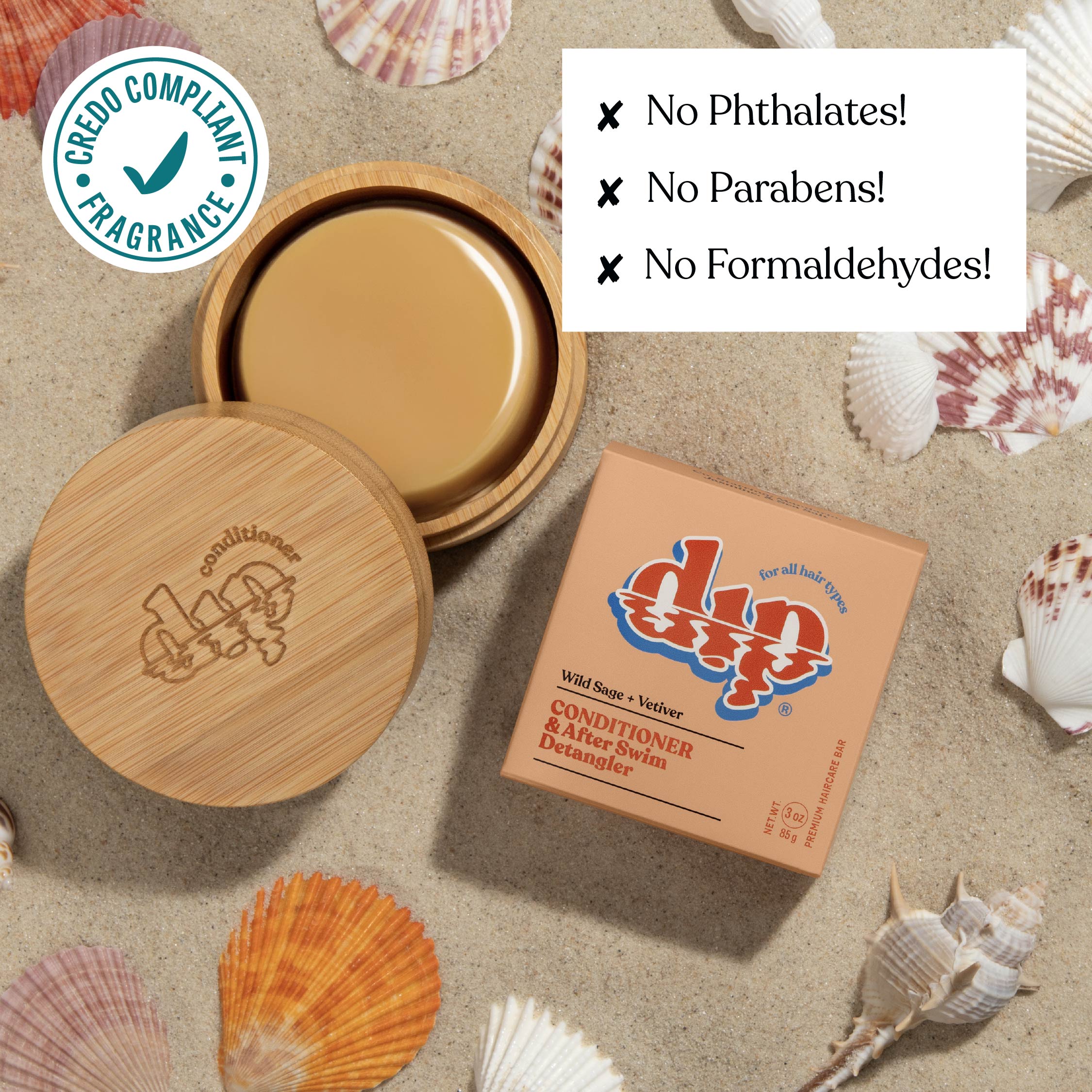 Bottle of conditioner with wooden cap and packaging on a sandy background with seashells.