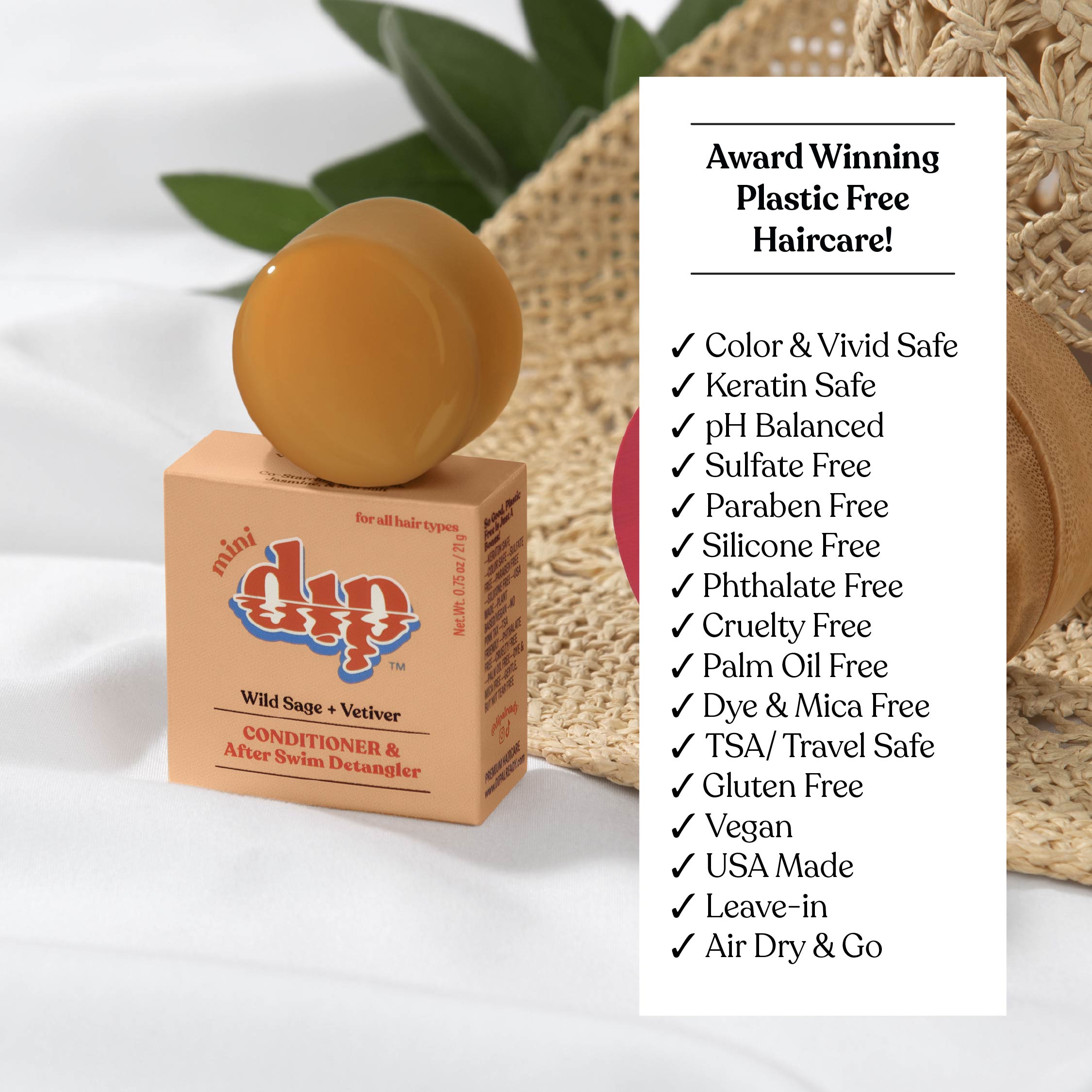 Bar of soap on a box with 'mini dip' branding, surrounded by plants and a woven basket.