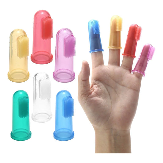 Colorful silicone finger toothbrushes on hand, sensory oral care tool for kids