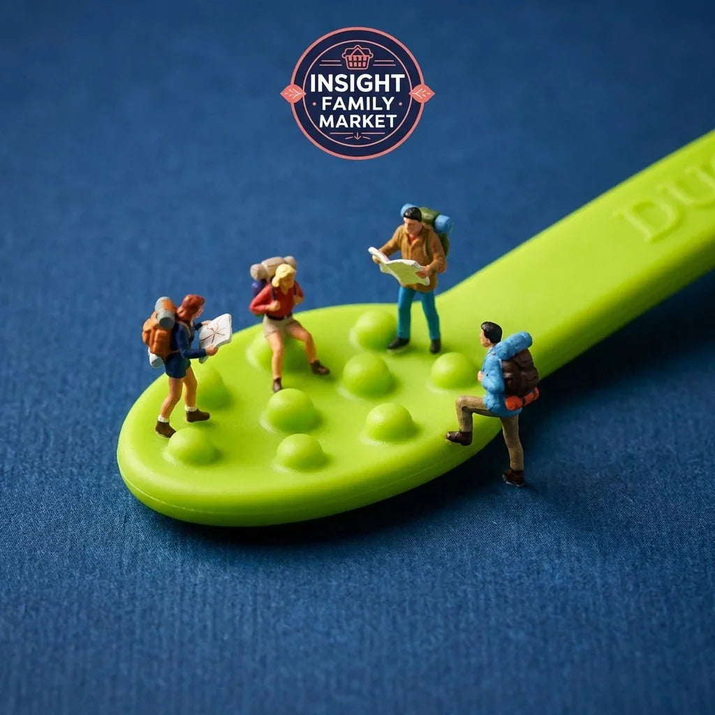 Green sensory kids spoon with textured bumps and miniature hikers on blue background