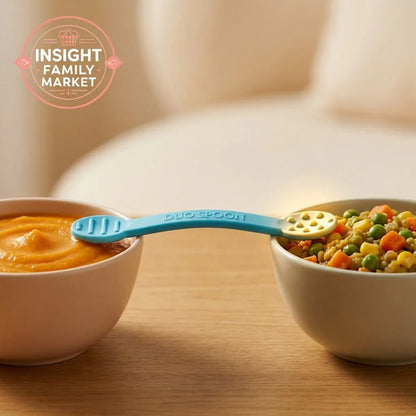 Blue Duo Spoon bridging two bowls of pureed and mixed vegetables on a table
