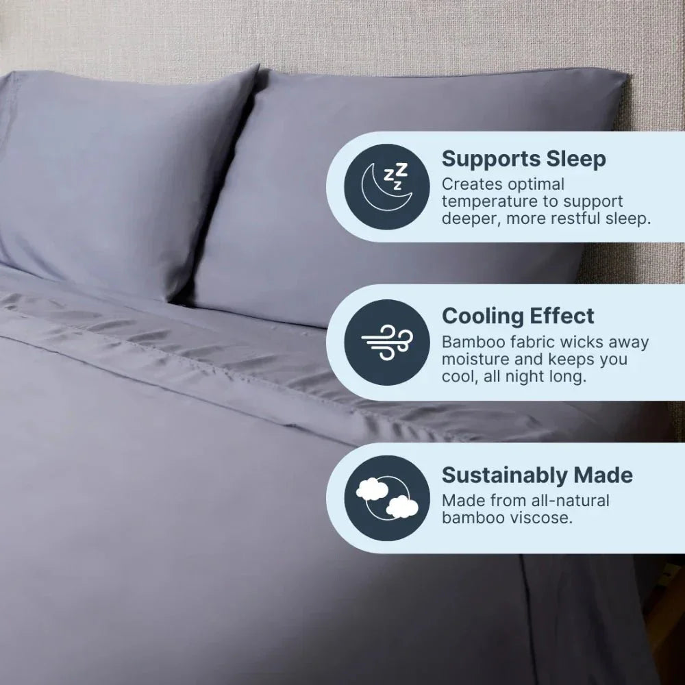 Grey cooling weighted blanket on bed, made from bamboo fabric, supporting sleep and sustainability.