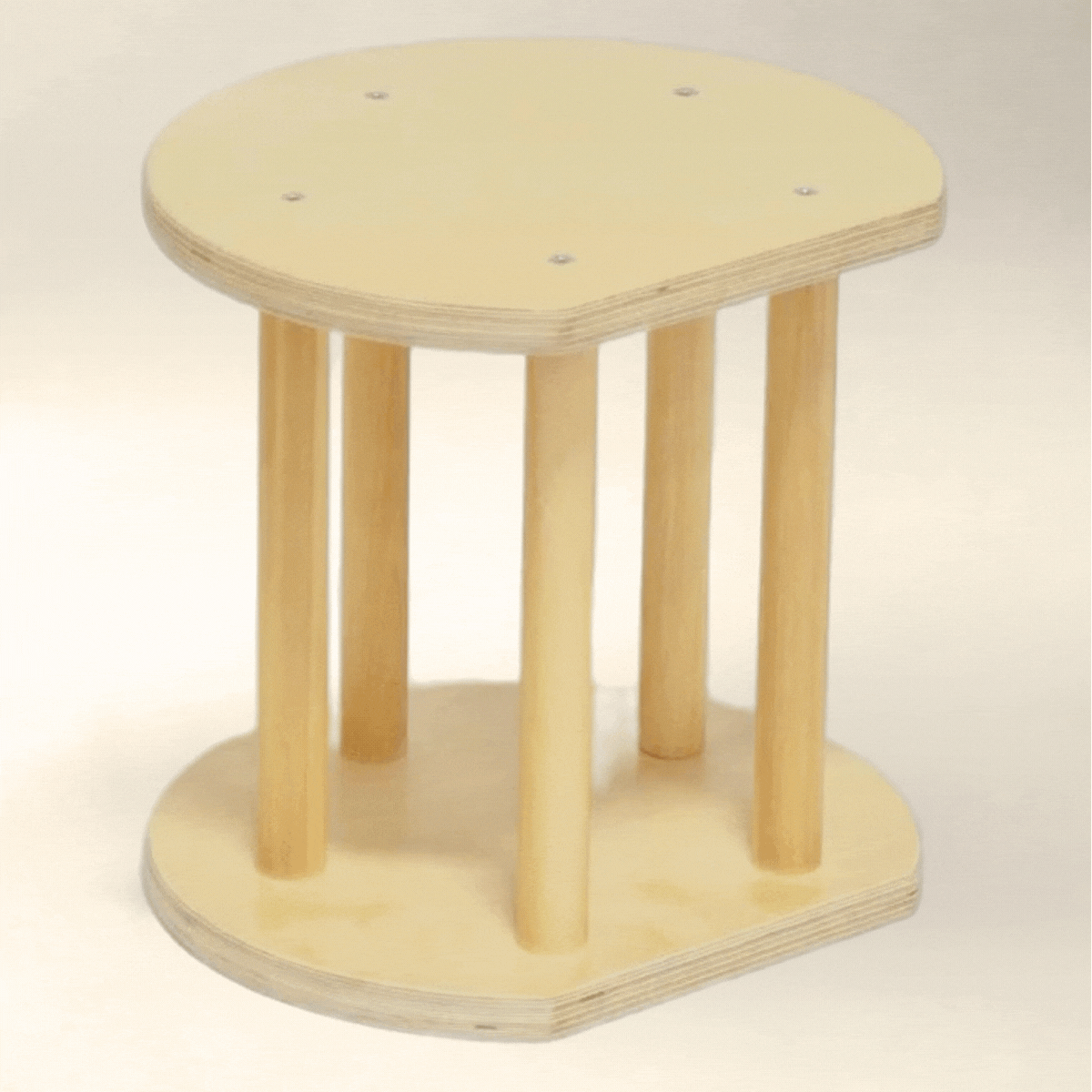Adjustable wooden toddler stool for sensory-friendly seating, rotating for height change