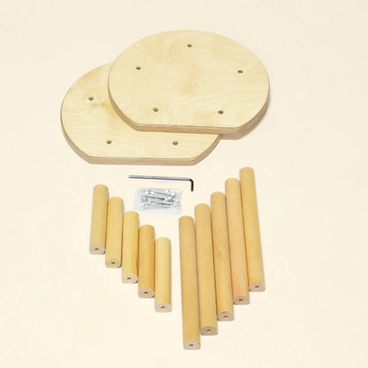 Wooden stool parts kit with round seats, dowel legs, screws, and hex key on a beige background.