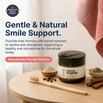 Natural fluoride-free tooth powder jar, wooden toothbrush, herbs, and cinnamon on a wooden table.