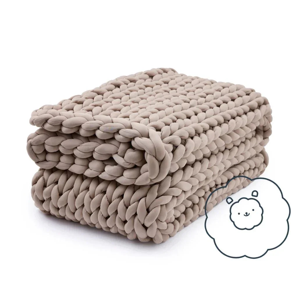 Chunky knit cooling weighted blanket in coastal sand color, folded with a cute cloud icon
