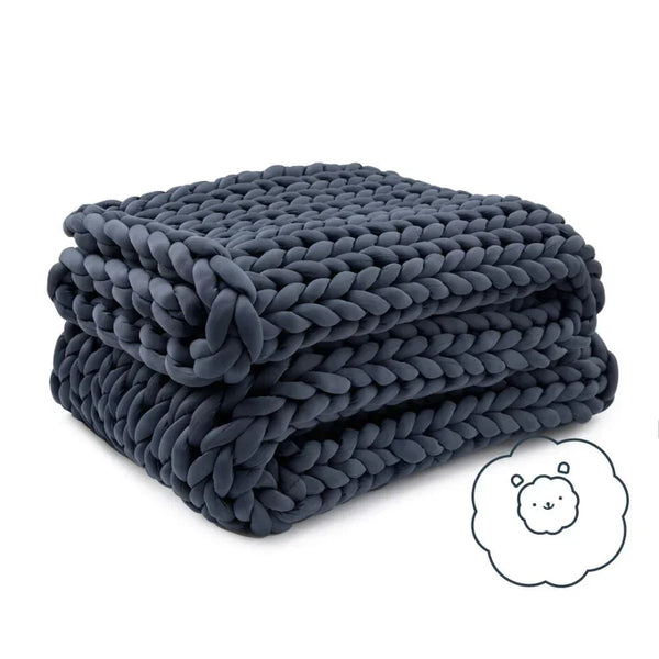Dark grey chunky knit cooling weighted blanket neatly folded on white background with a cute sheep icon.