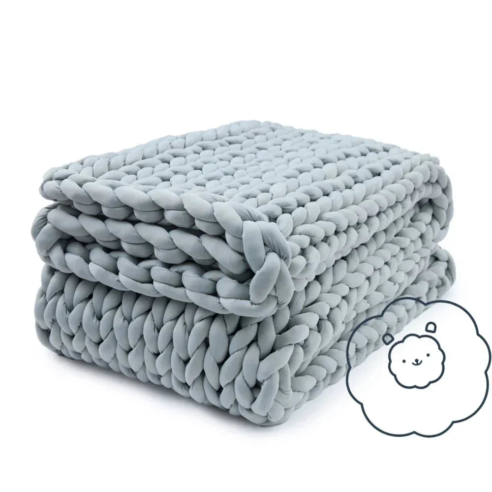 Folded silver knit cooling weighted blanket with chunky texture and a cute cloud illustration