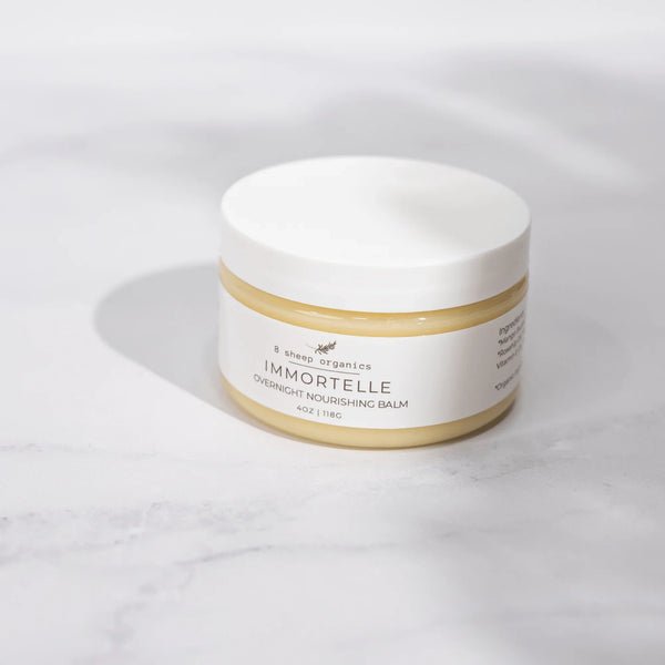 8 Sheep Organics Immortelle Overnight Nourishing Balm jar on a marble surface