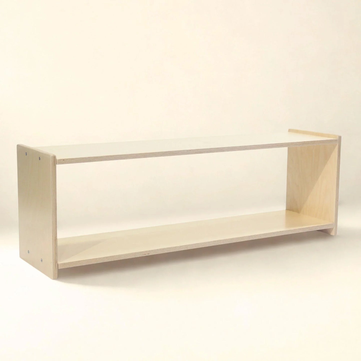 Natural wood Montessori infant shelf with open design and rounded edges on white background