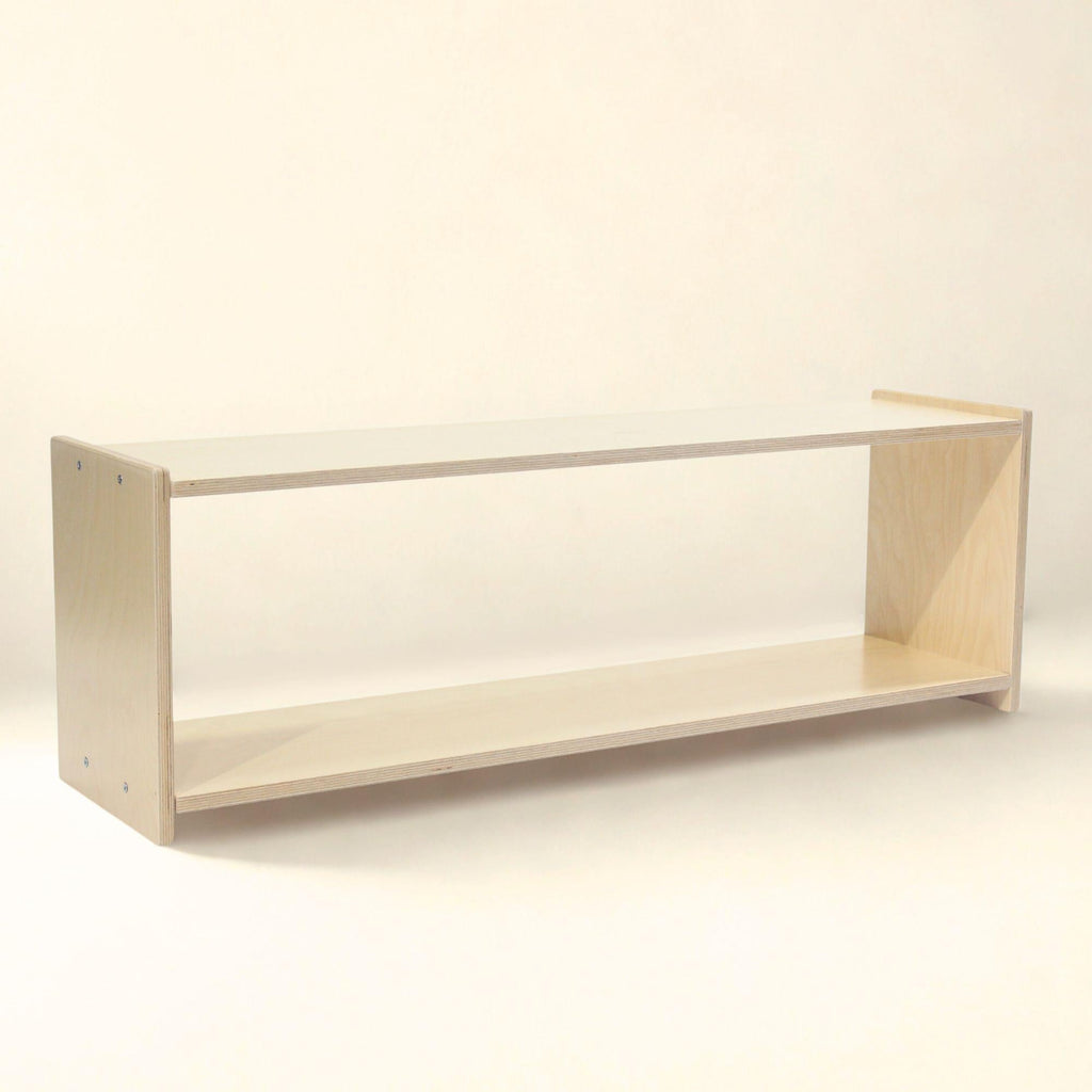 Minimalist wooden shelf on a plain background