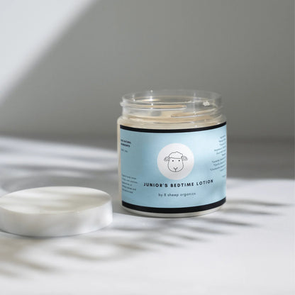 Jar of Junior's Bedtime Lotion for kids with open lid, soothing sleep aid for sensitive skin