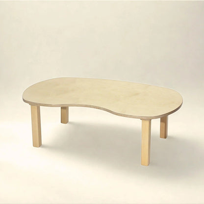 Kidney-shaped wooden toddler sensory table with light wood finish in a neutral setting