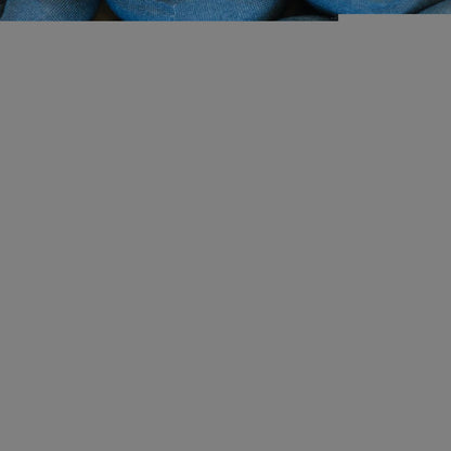 Close-up of soft dusty blue sensory-friendly fabric pants for kids