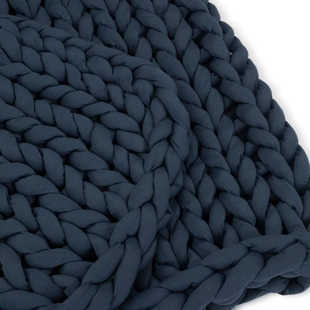 Closeup of chunky knit dusty blue sensory-friendly weighted blanket