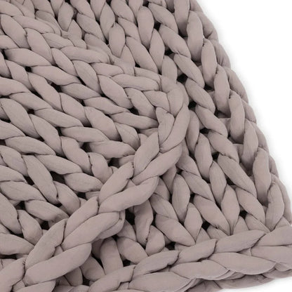 Closeup of chunky knit dusty rose sensory blanket made with soft fabric