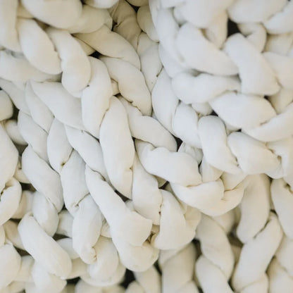 Closeup of soft cream chunky knit weighted blanket, sensory-friendly texture