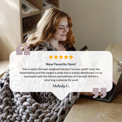Woman using a chunky knitted weighted blanket at a desk with a laptop, product testimonial overlay.