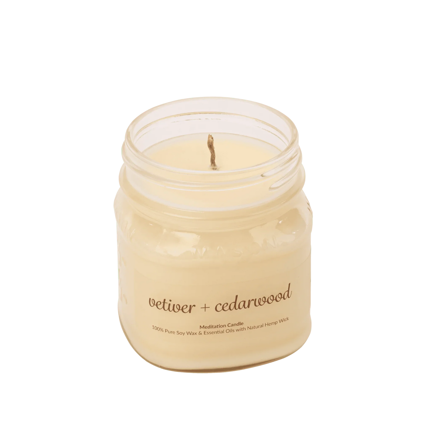 Vetiver cedarwood soy wax meditation candle with essential oils in a glass jar