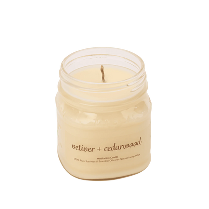 Vetiver cedarwood soy wax meditation candle with essential oils in a glass jar