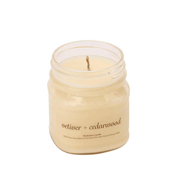 Vetiver cedarwood soy wax meditation candle with essential oils in a glass jar