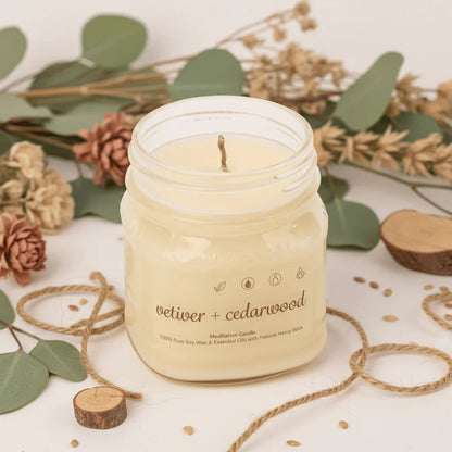 Soy wax vetiver and cedarwood candle in jar with natural decor and twine