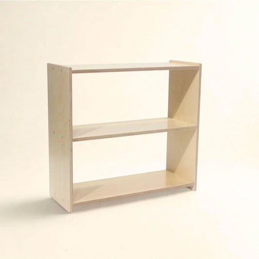 Montessori wooden shelf with three open tiers, natural finish, minimal design on white background