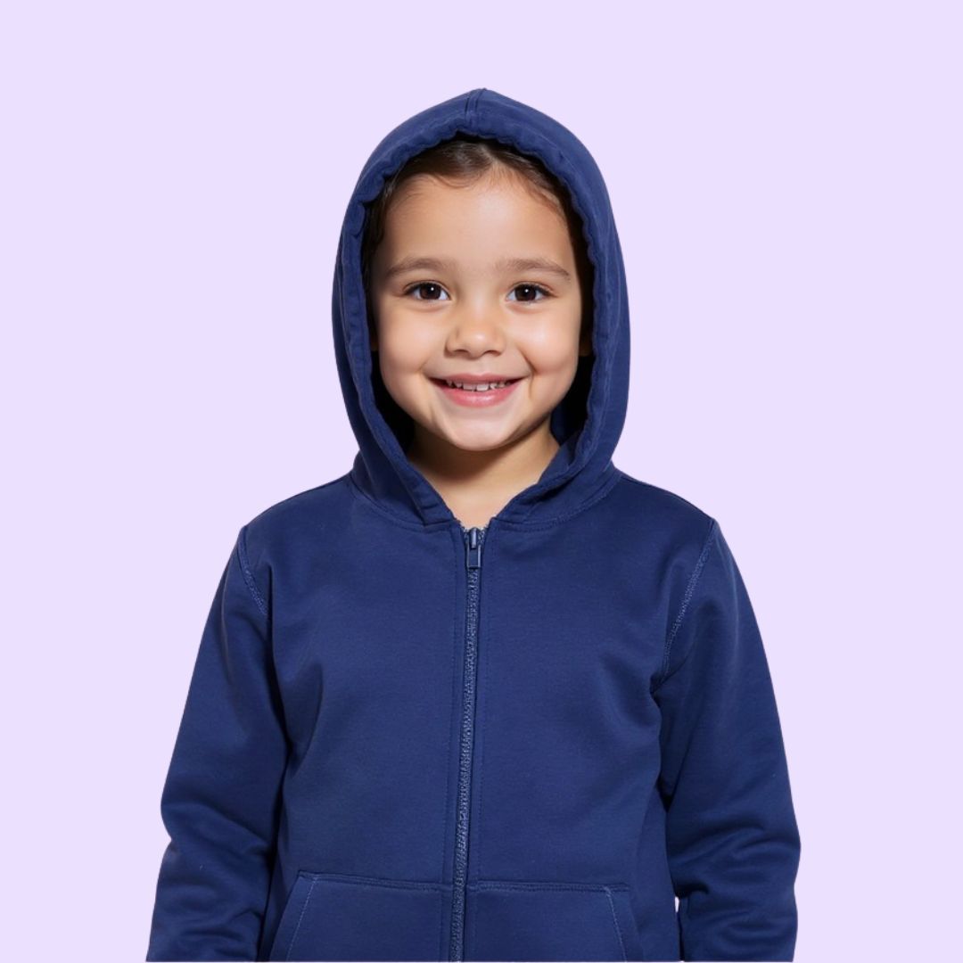 Child wearing a blue hoodie against a light purple background