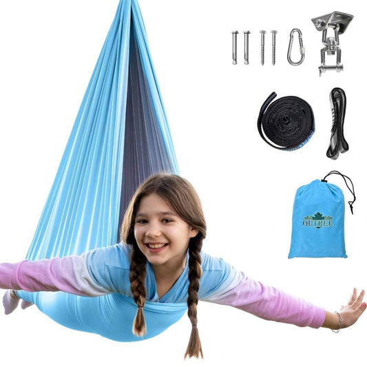 Smiling child in a blue sensory swing hammock with all installation hardware and storage bag shown.