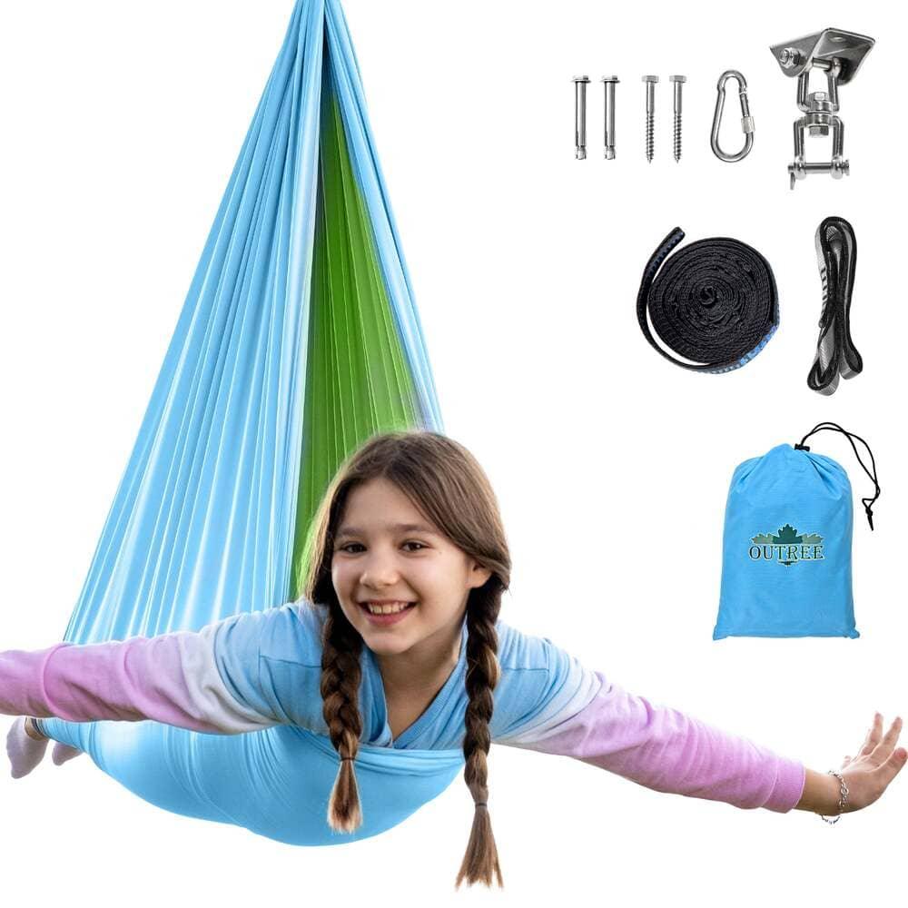 Smiling girl in blue sensory swing hammock with installation kit and storage bag