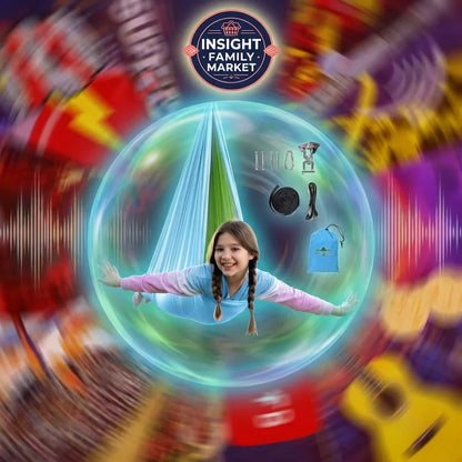Smiling girl in sensory swing hammock with setup kit, surrounded by colorful, blurred background.