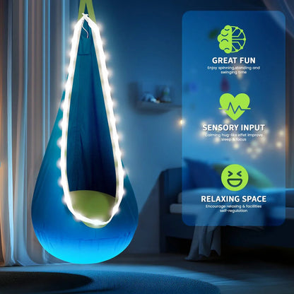 Blue sensory swing pod with string lights in a cozy bedroom, promotes calming sensory input and relaxation.
