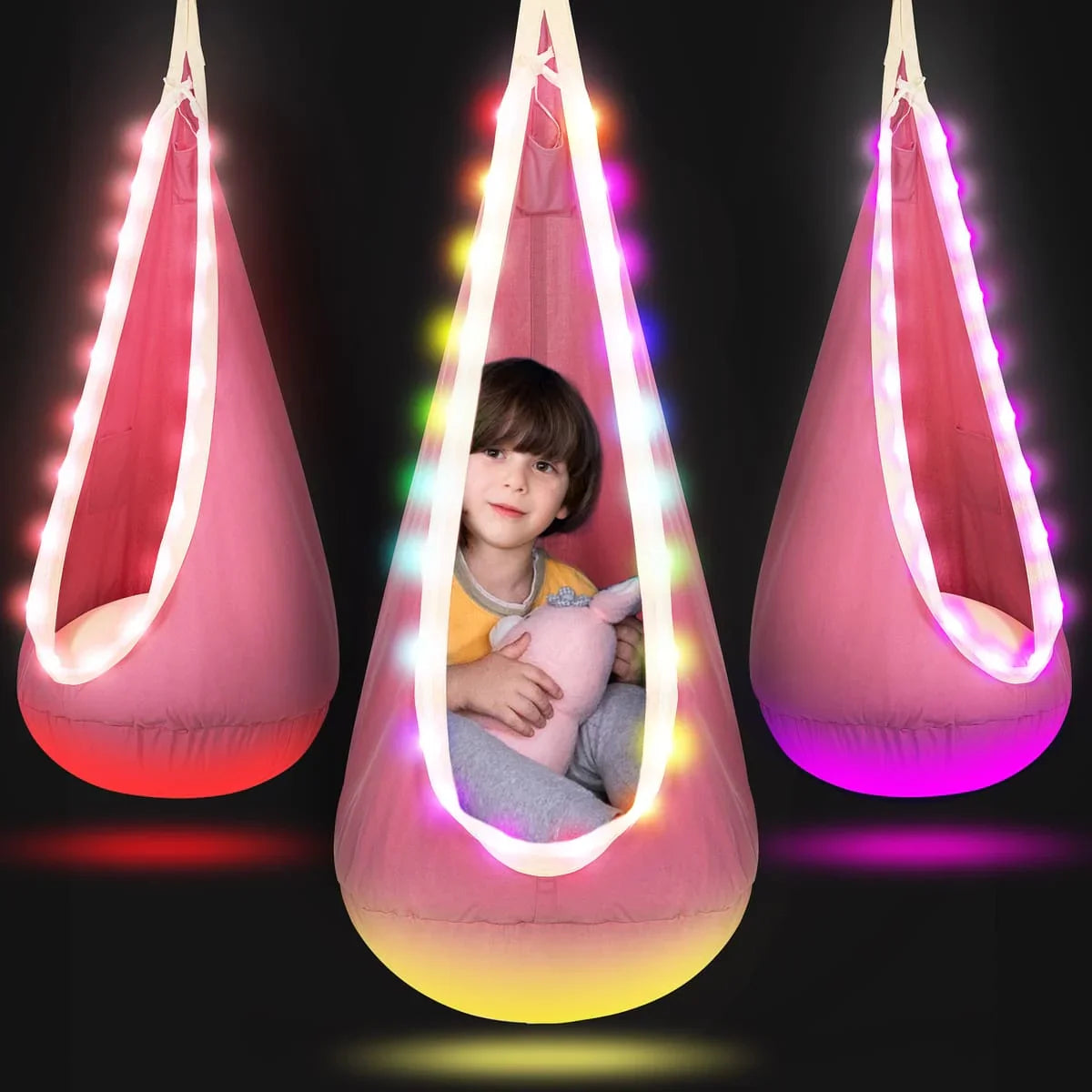 Pink sensory swing pod chair with LED lights, child sitting inside, sensory-friendly seating