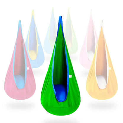 Green and blue sensory pod swing for kids with cushion, surrounded by colorful swings