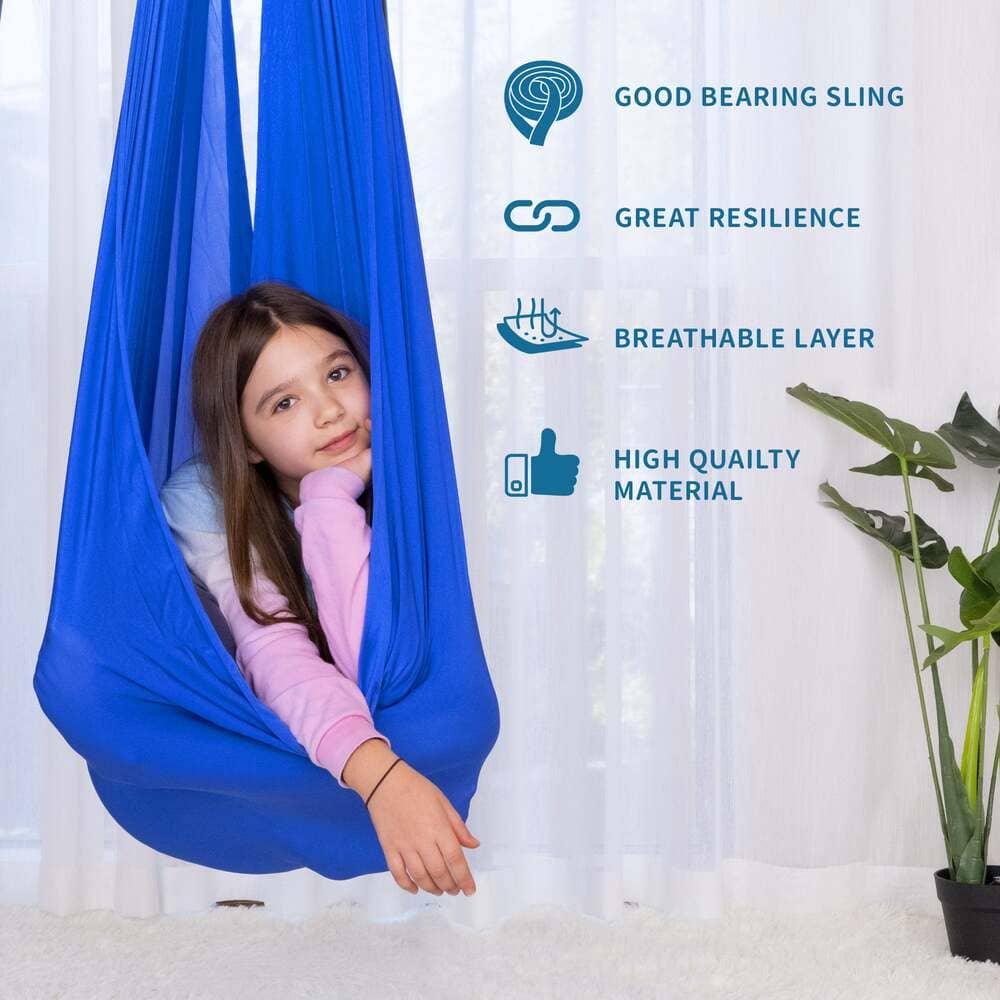 Child in blue sensory swing hammock indoors, with icons showing features like breathable, resilient fabric.
