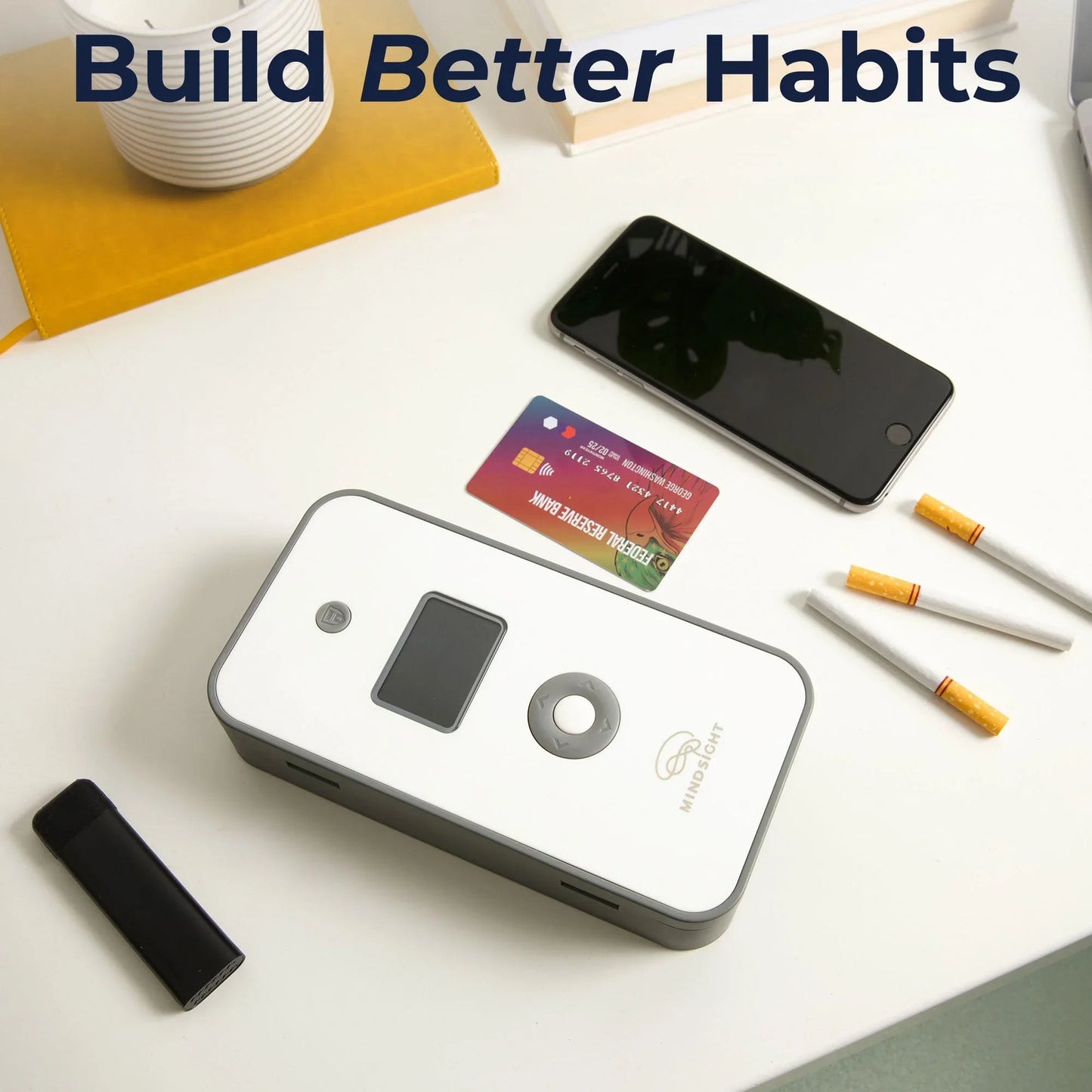 Personal timed lock box with phone, cigarettes, and credit card on desk for habit control