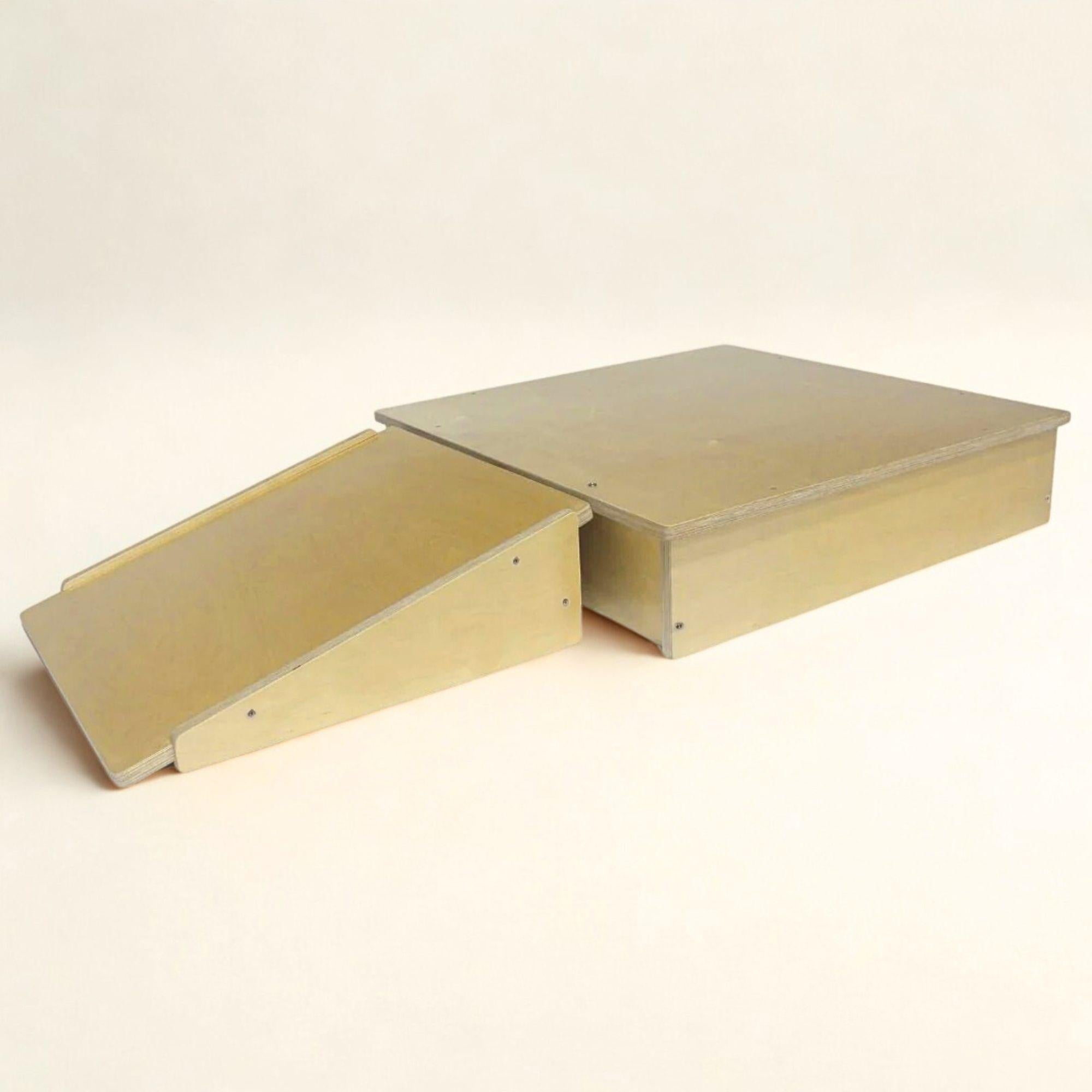 Two metal ramps on a beige background