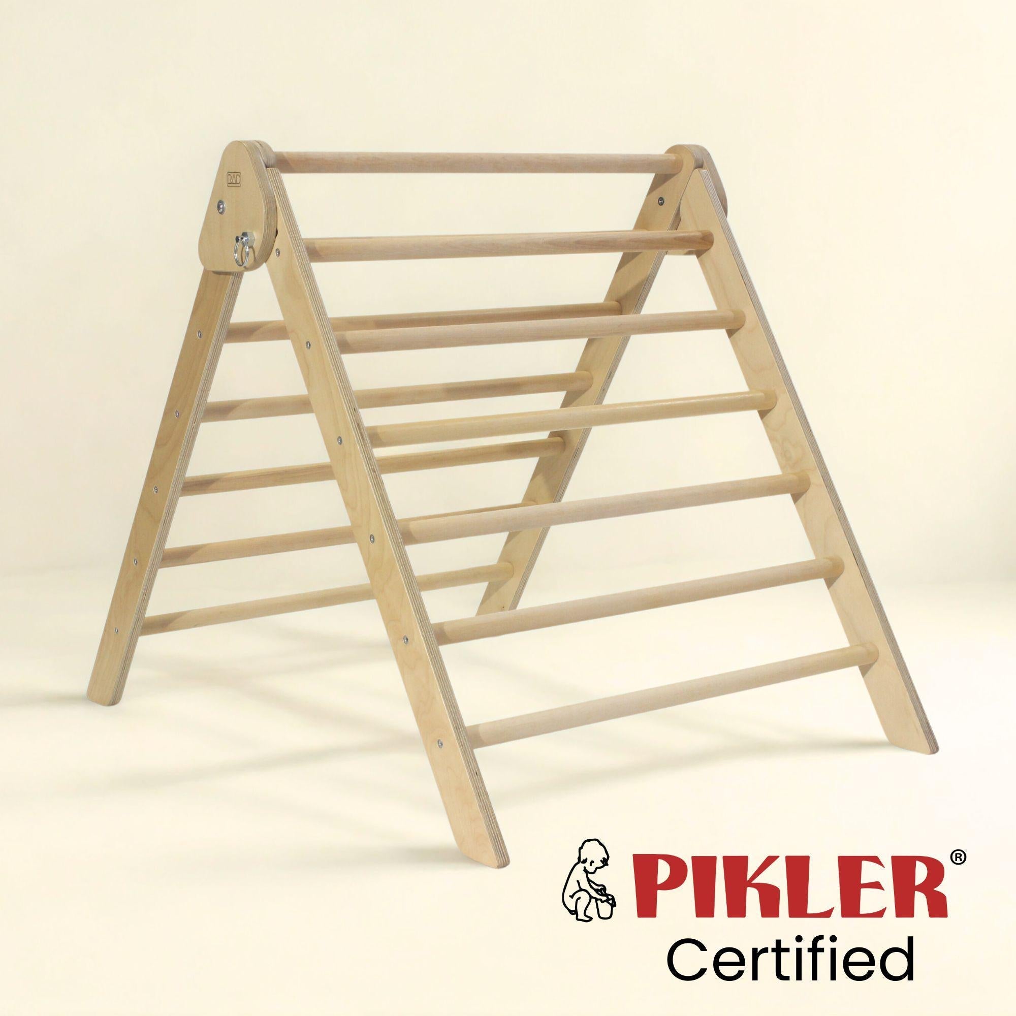 Wooden climbing triangle with Pikler Certified logo on a beige background