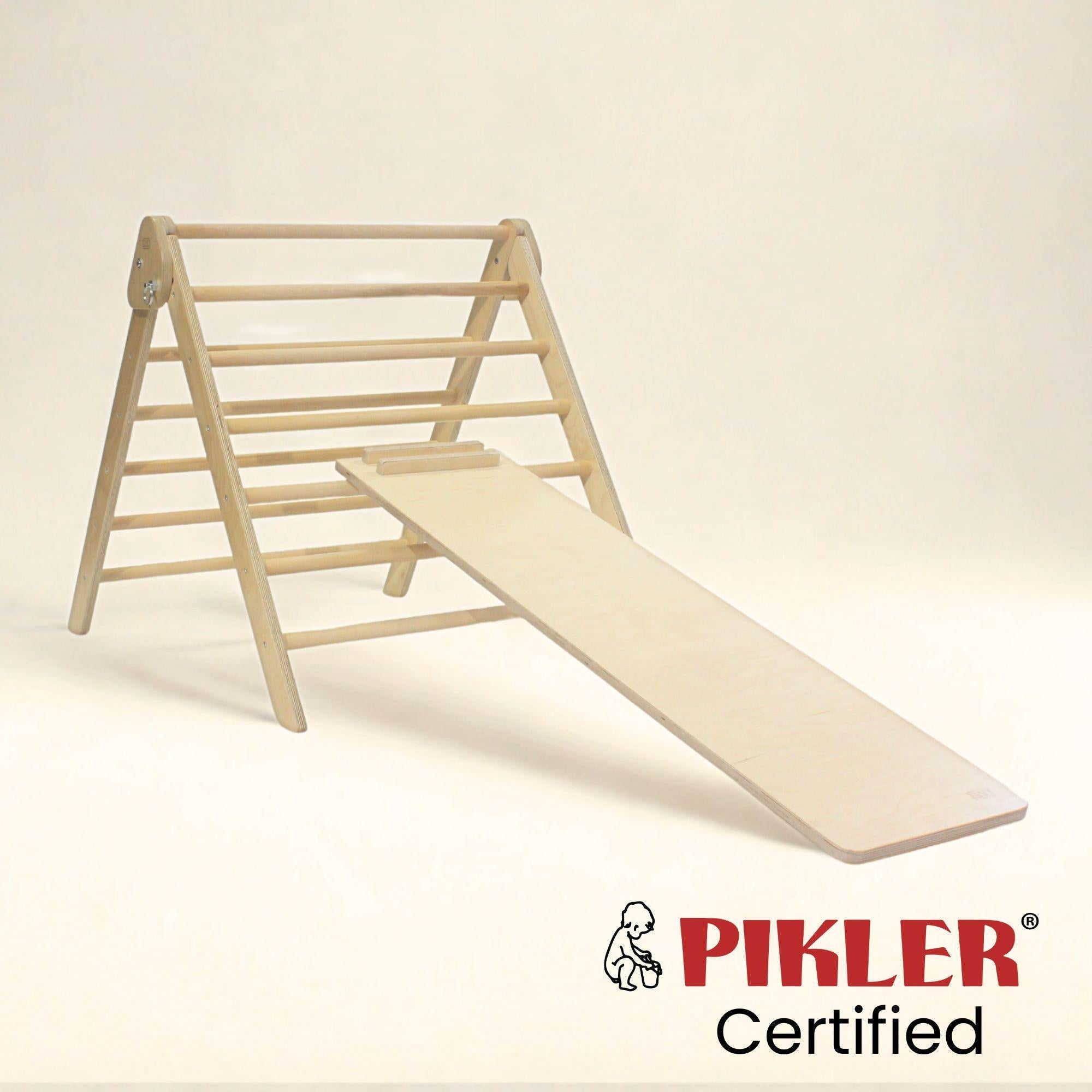 Wooden climbing frame with slide on a beige background, featuring the Pikler Certified logo.