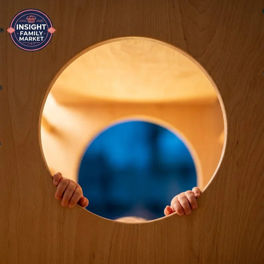 Child’s hands holding sensory play tunnel, wooden calm space for kids’ sensory needs