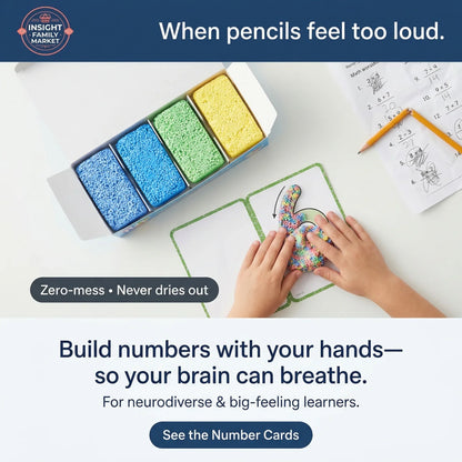 Children's hands interacting with colorful number cards and a container of sand on a table.