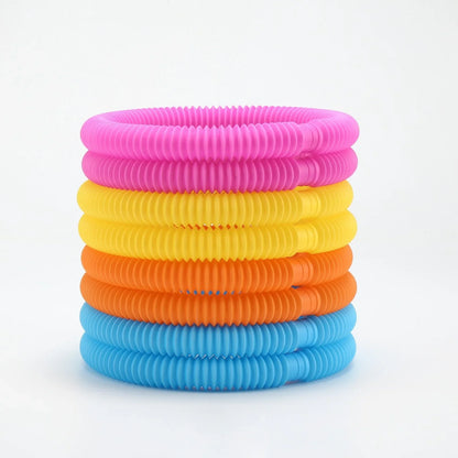 Stack of colorful sensory pop tubes for kids, fidget toy for autism and ADHD support
