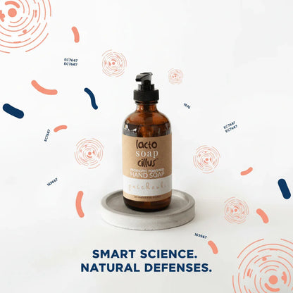 Probiotic powered hand soap in amber bottle with pump, patchouli scent, on white background.