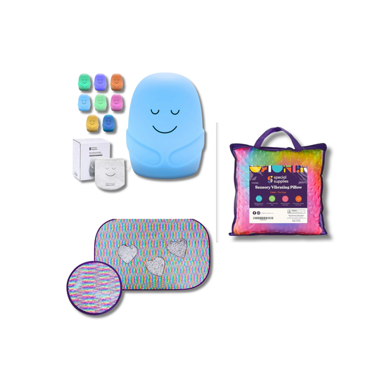 Collection of colorful items including a blue pillow with smiley face, packaging, and accessories on a white background.