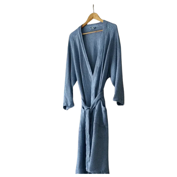 Blue checkered robe on a hanger against a white background