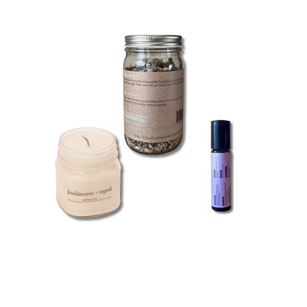 Three products on a white background: a candle, a jar with a metal lid, and a small bottle.