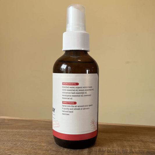 Amber spray bottle with essential oils and natural ingredients label for air purifying.