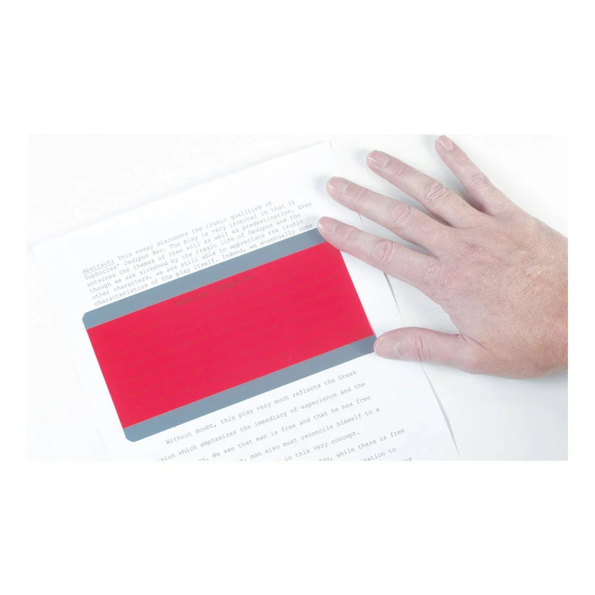 Hand using a red reading guide strip over text for dyslexia and reading support