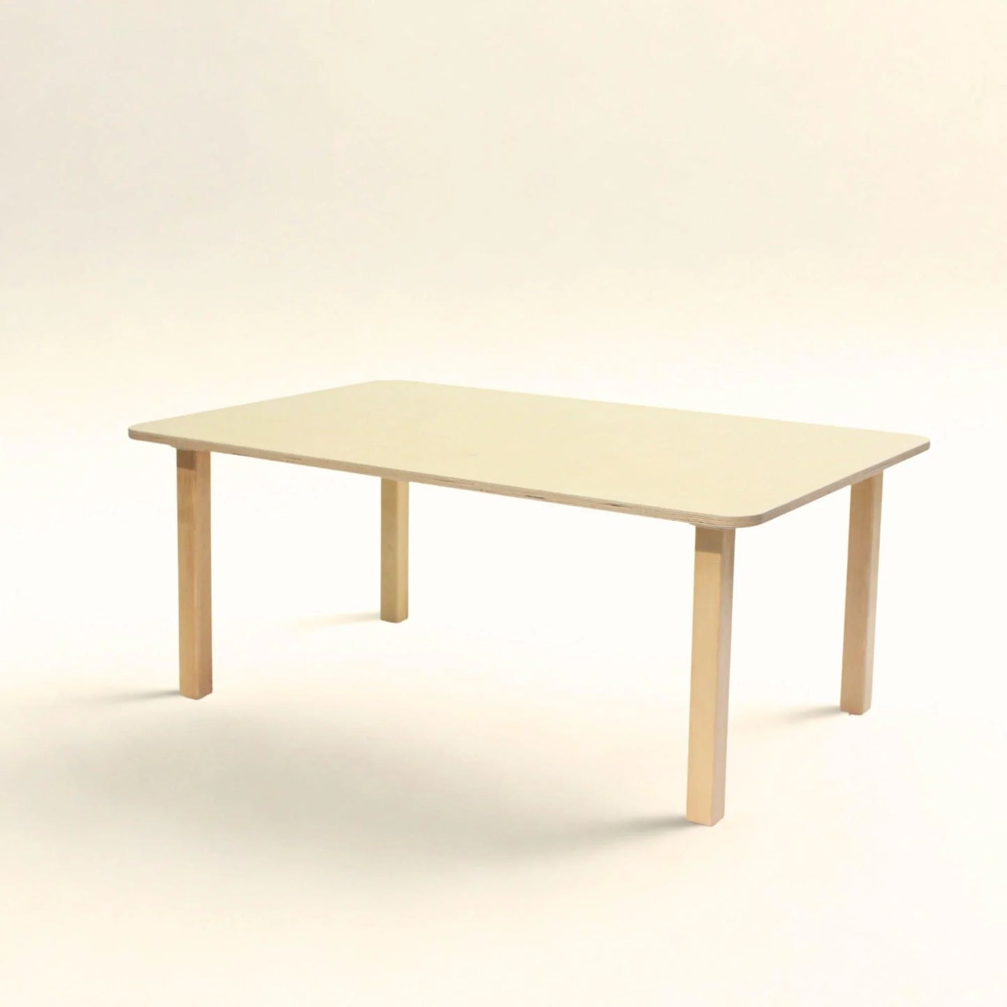 Rectangular wooden preschool activity table with rounded corners on white background