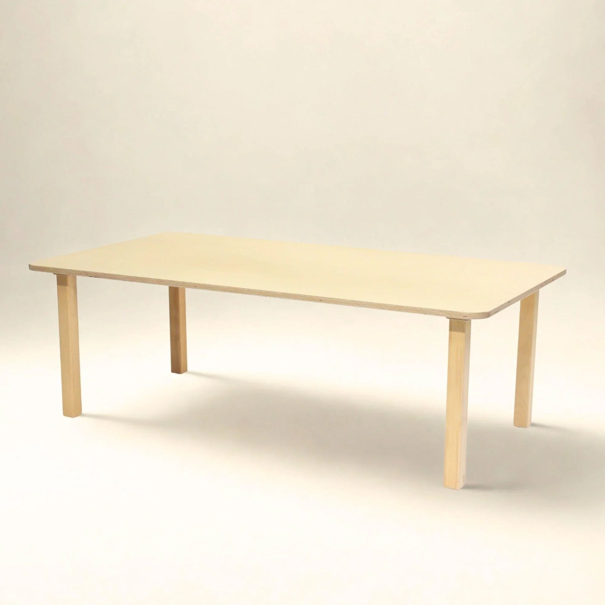 Rectangular wooden preschool table with rounded corners, light natural finish